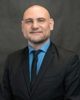 Portrait photo of Adrian Robak